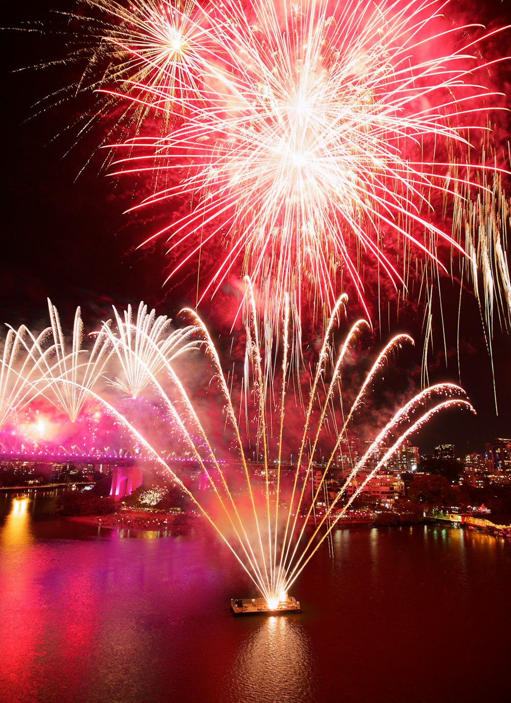 a large fireworks display over a body of water