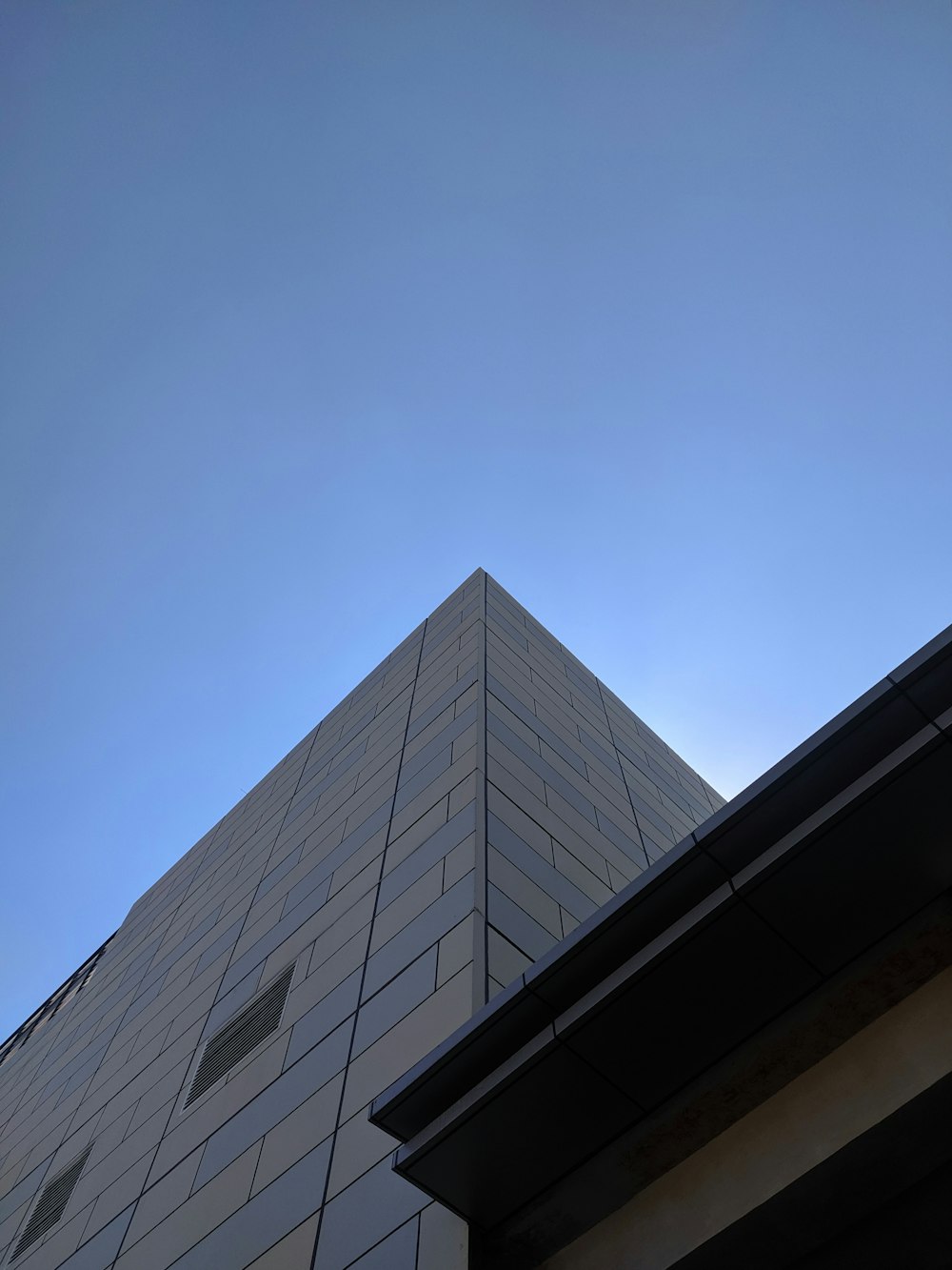 a very tall building with a sky in the background