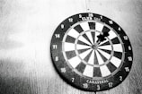 a dart hitting in the center of a dartboard