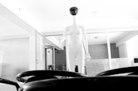 A minimalist studio setup with a mannequin dressed in monochic’s latest black and white collection.