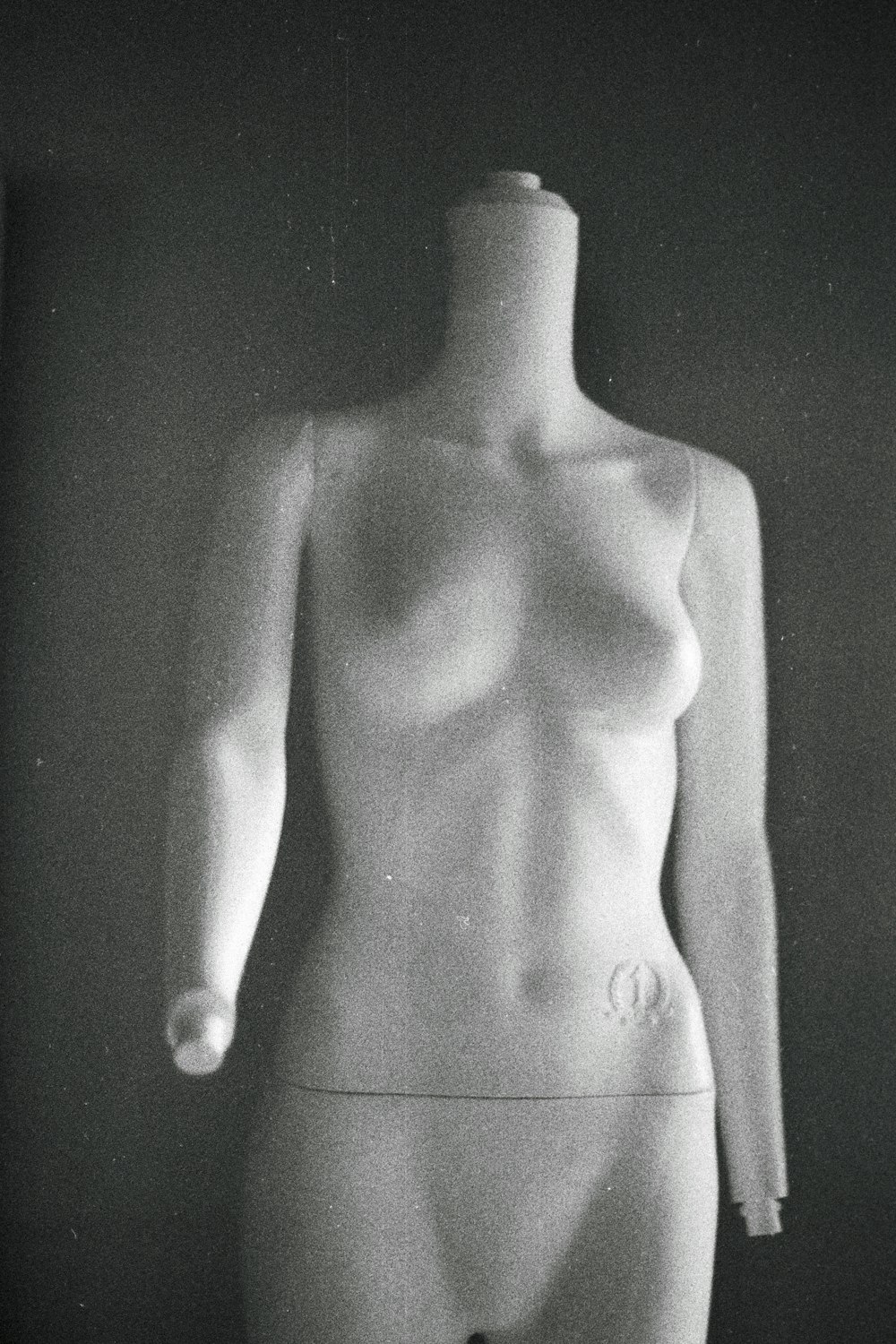 a black and white photo of a female mannequin