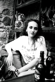 A model wearing a humorous t-shirt in a casual setting.