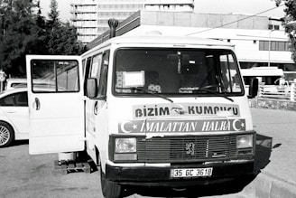 A service van with 'tv ustası' logo parked in an Istanbul neighborhood.