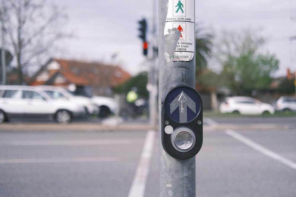 a pole with a sign on it in the middle of a street