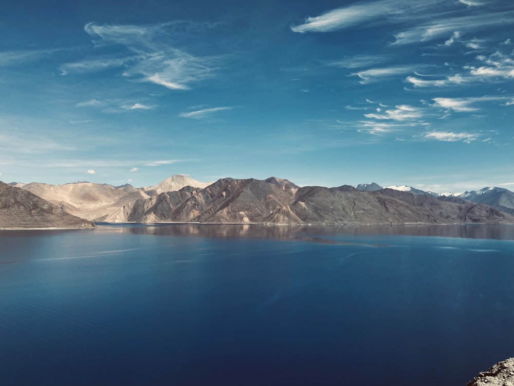 a large body of water surrounded by mountains