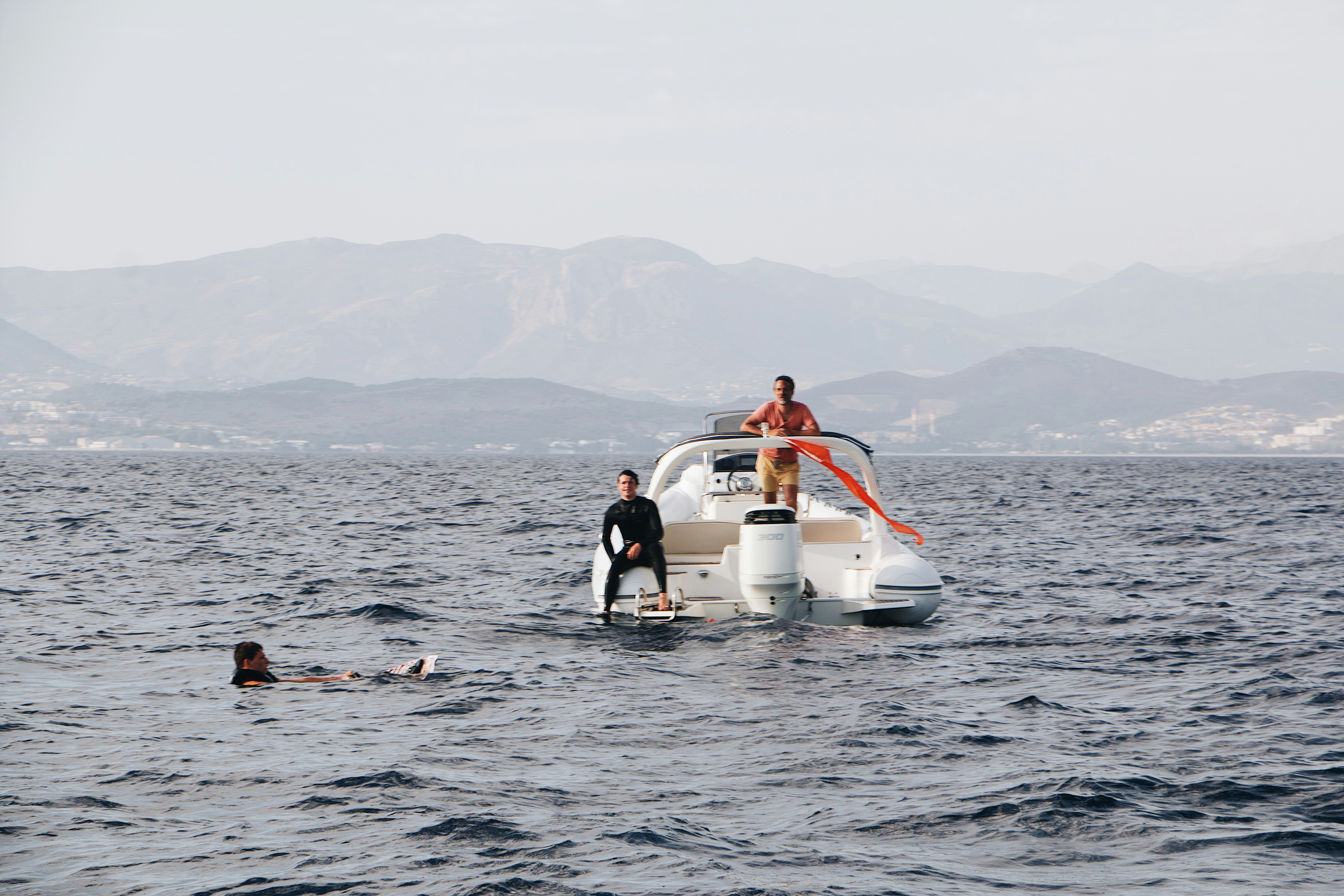 a couple of people on a boat in the water