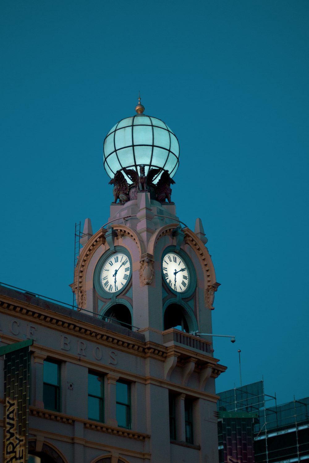 a large clock tower with a sky background