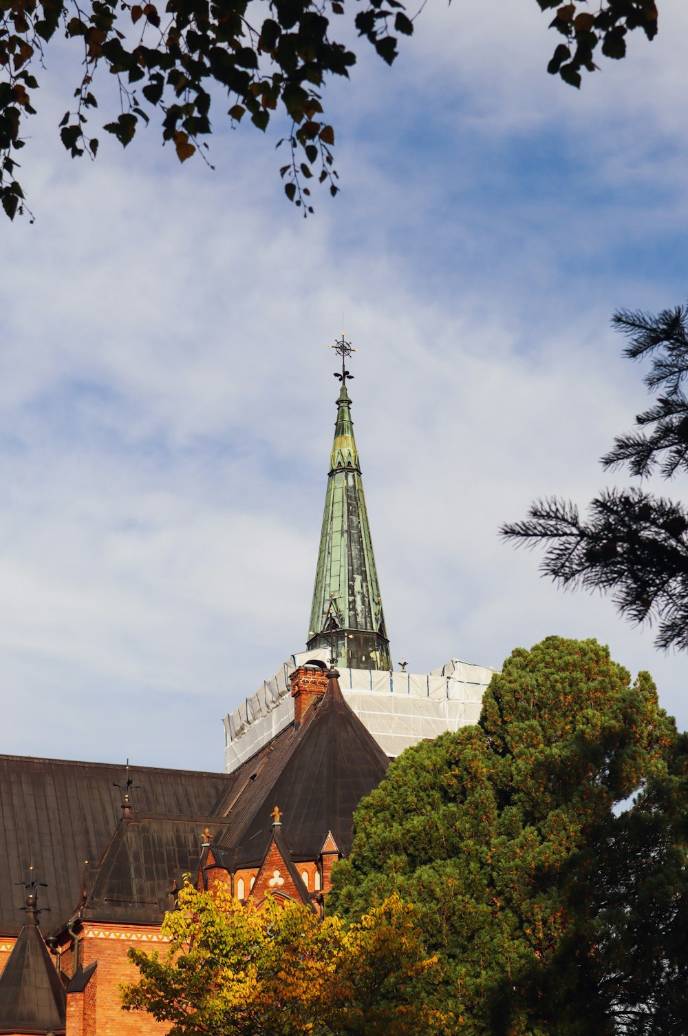 a church steeple with a cross on top of it