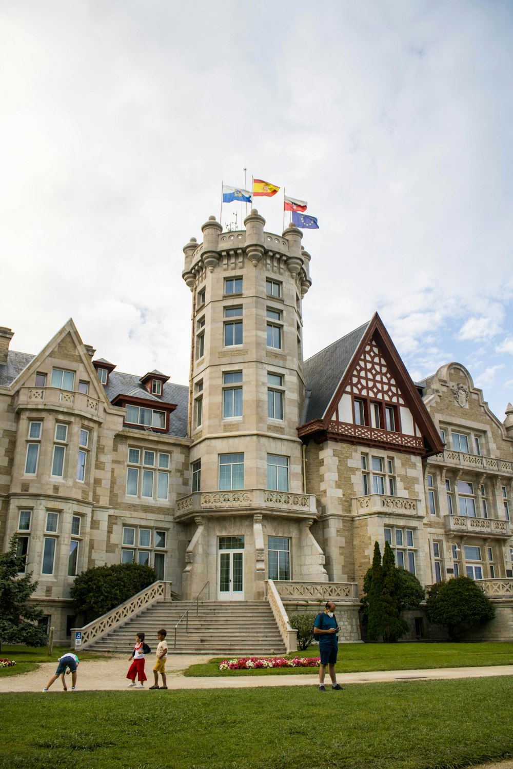 a group of people standing in front of a large building