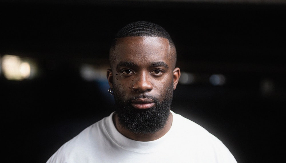 a close up of a person wearing a white shirt