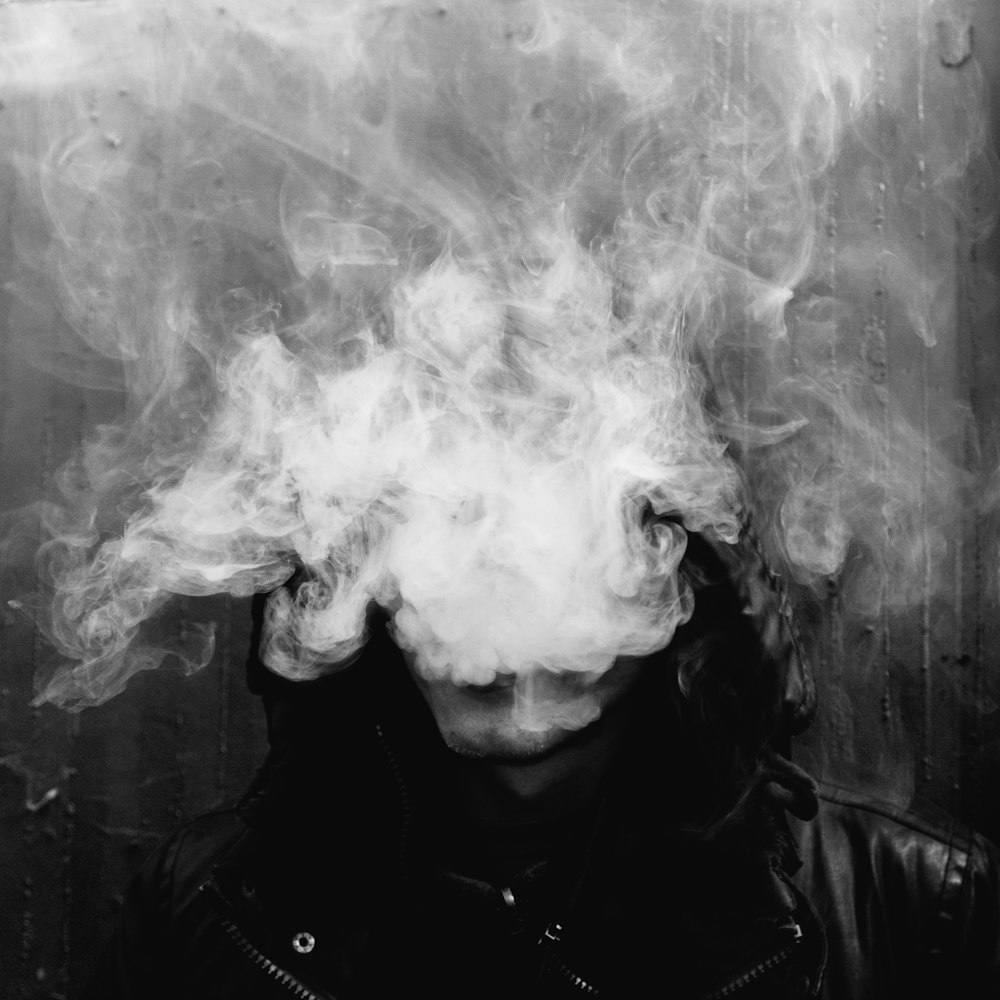a person with smoke coming out of their head