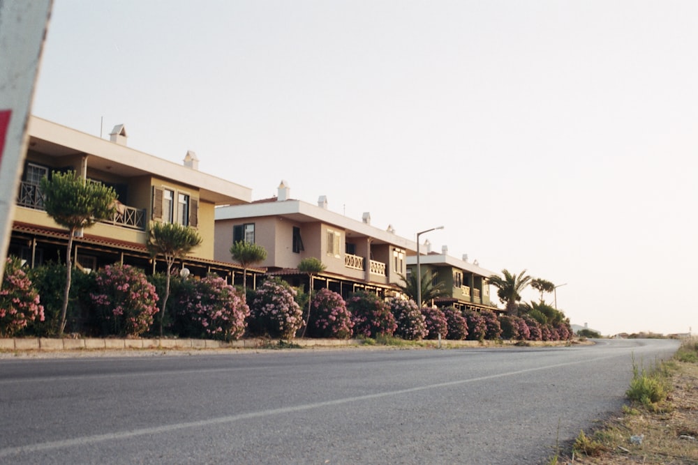 a row of houses on the side of a road