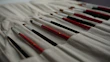 A set of replacement brushes and filters laid out neatly on a wooden table.