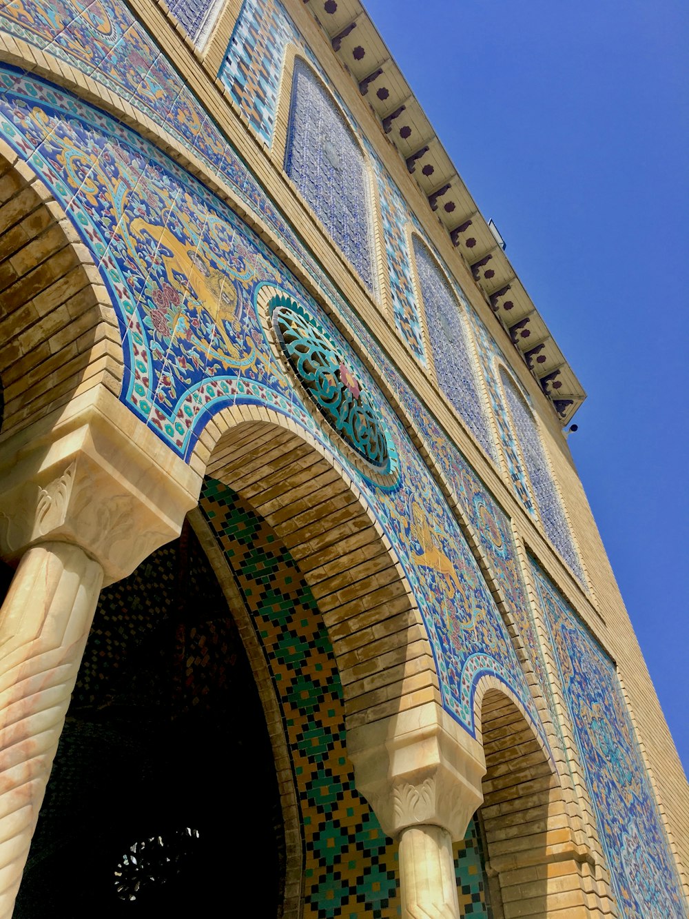 a close up of a building with a blue sky in the background