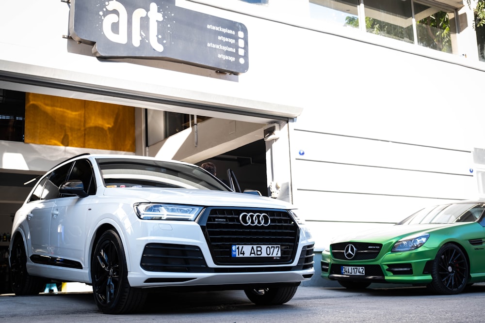 two cars parked in front of a building