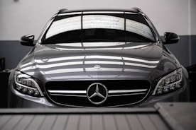 a mercedes benz car parked in a garage