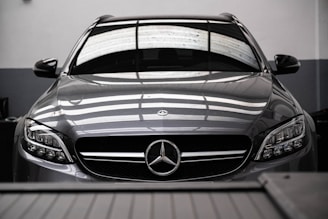 a mercedes benz car parked in a garage