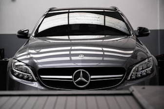 a mercedes benz car parked in a garage