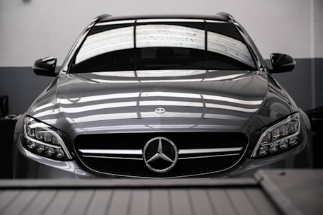 a mercedes benz car parked in a garage