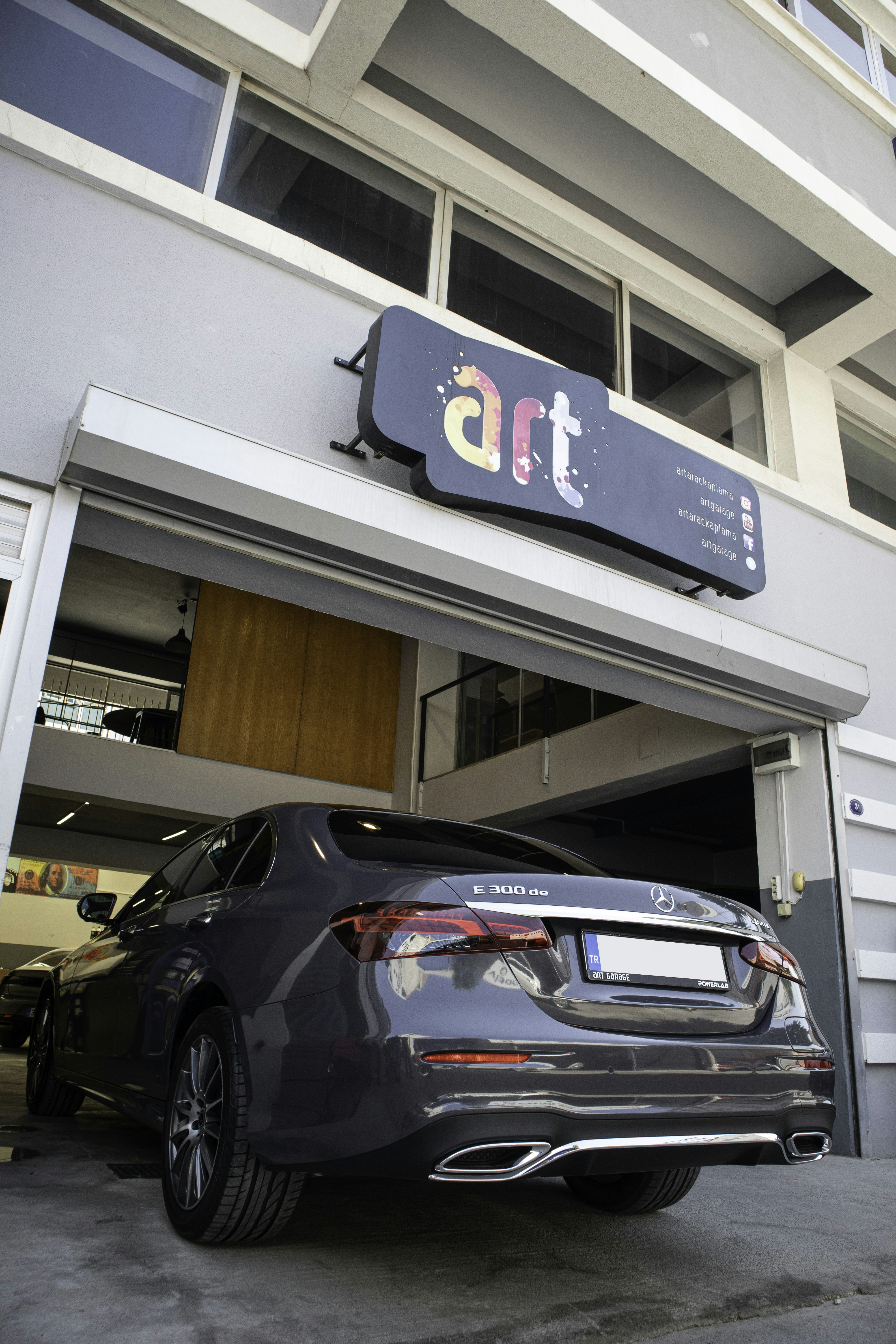 a car is parked in front of a building