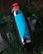 Brightly colored insulated stainless steel water bottle with playful kids’ designs on a kitchen counter.