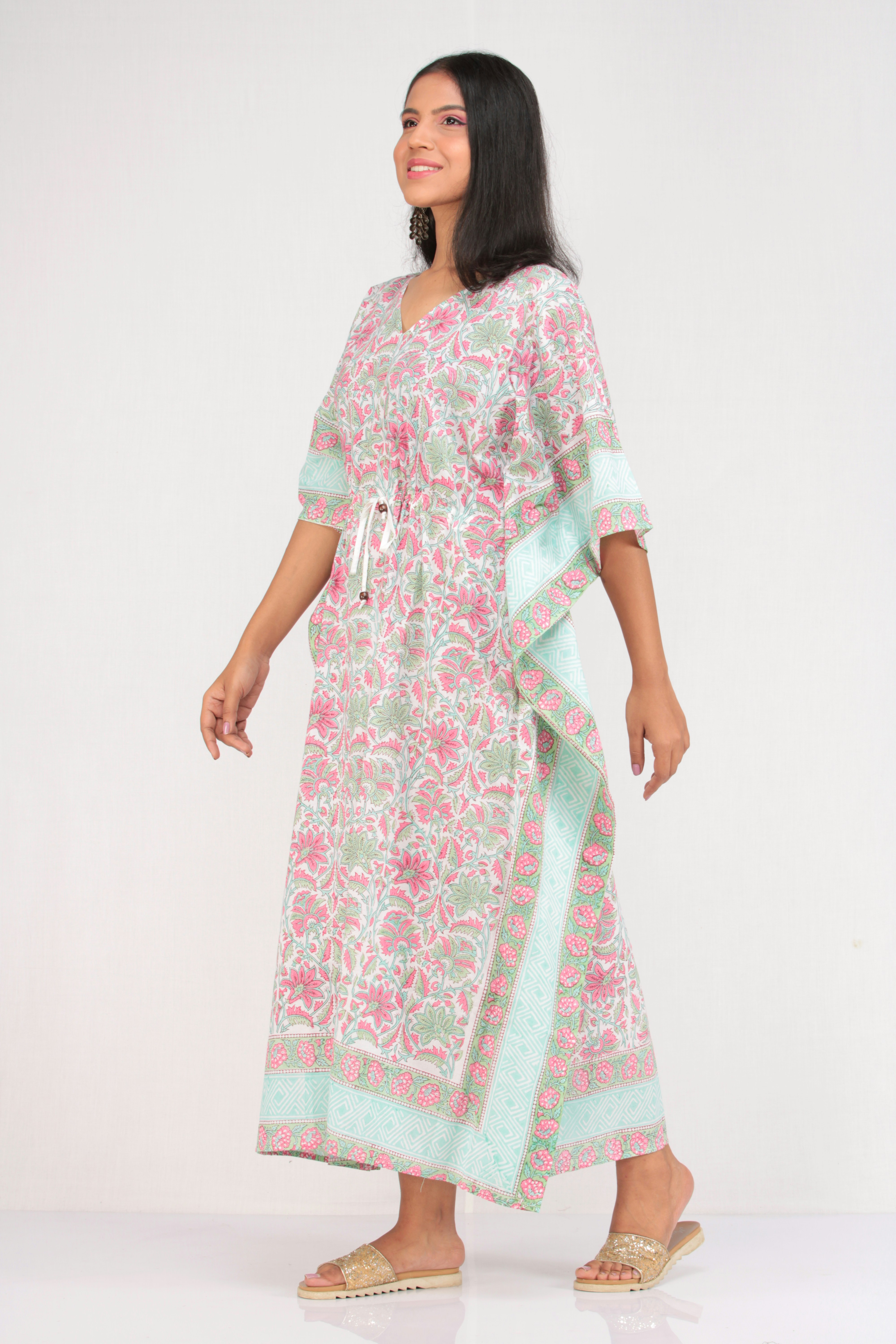 A woman wearing a pink and green dress photo – Free Girl Image on Unsplash