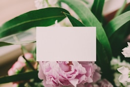 a close up of a flower with a card in the middle