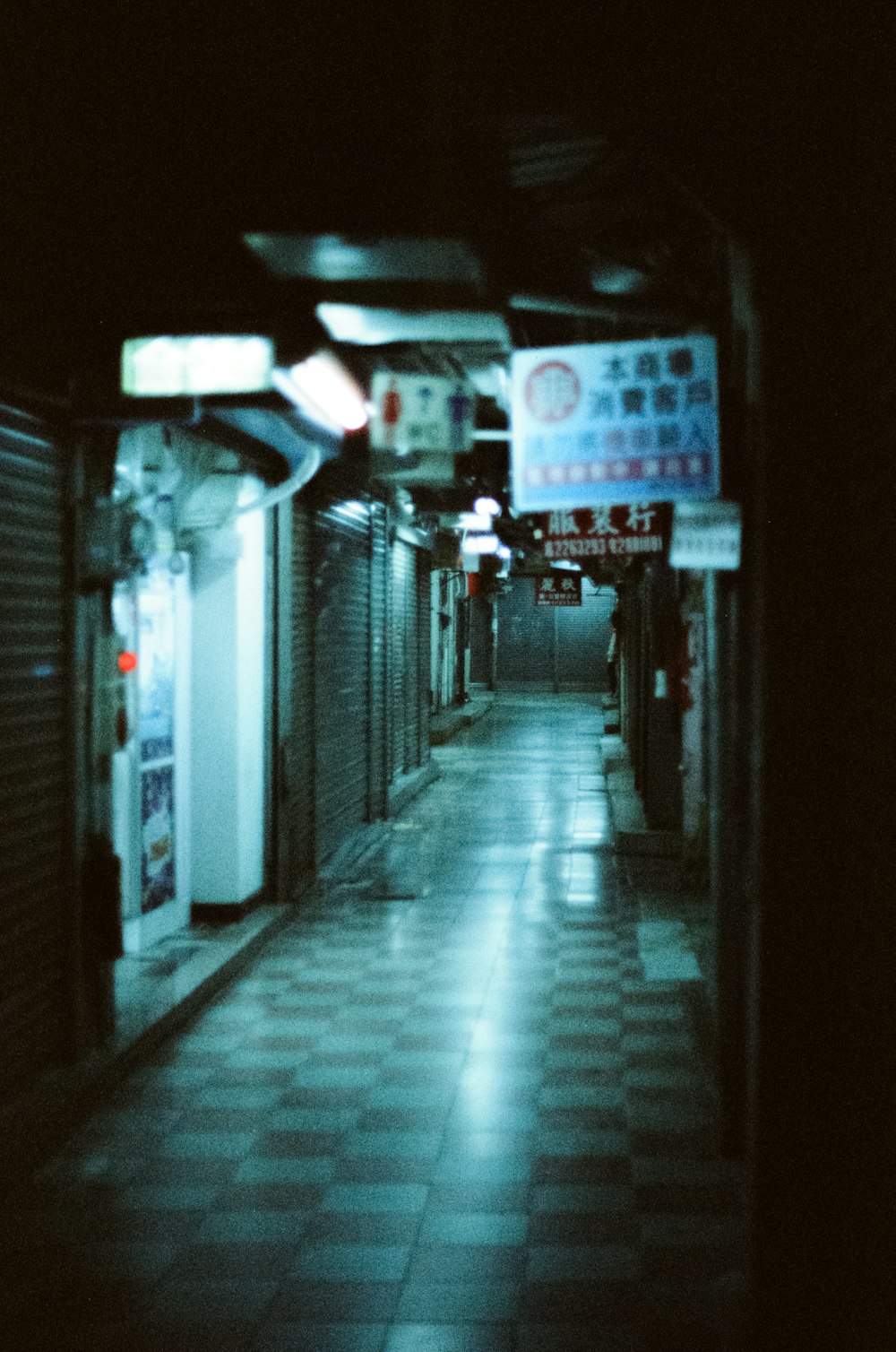 a long hallway with a sign on the wall