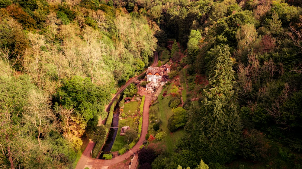 an aerial view of a house surrounded by trees