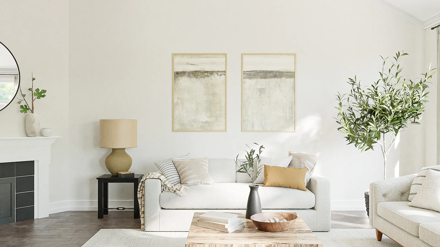 A freshly painted living room with a deep green feature wall, light trim, and natural daylight.