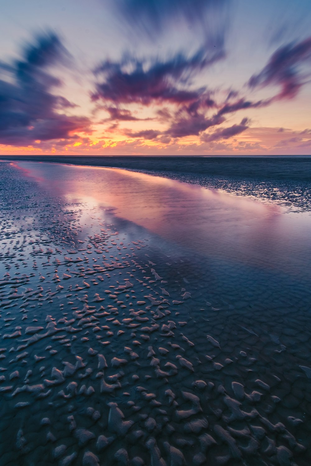 a beach that has some rocks in it