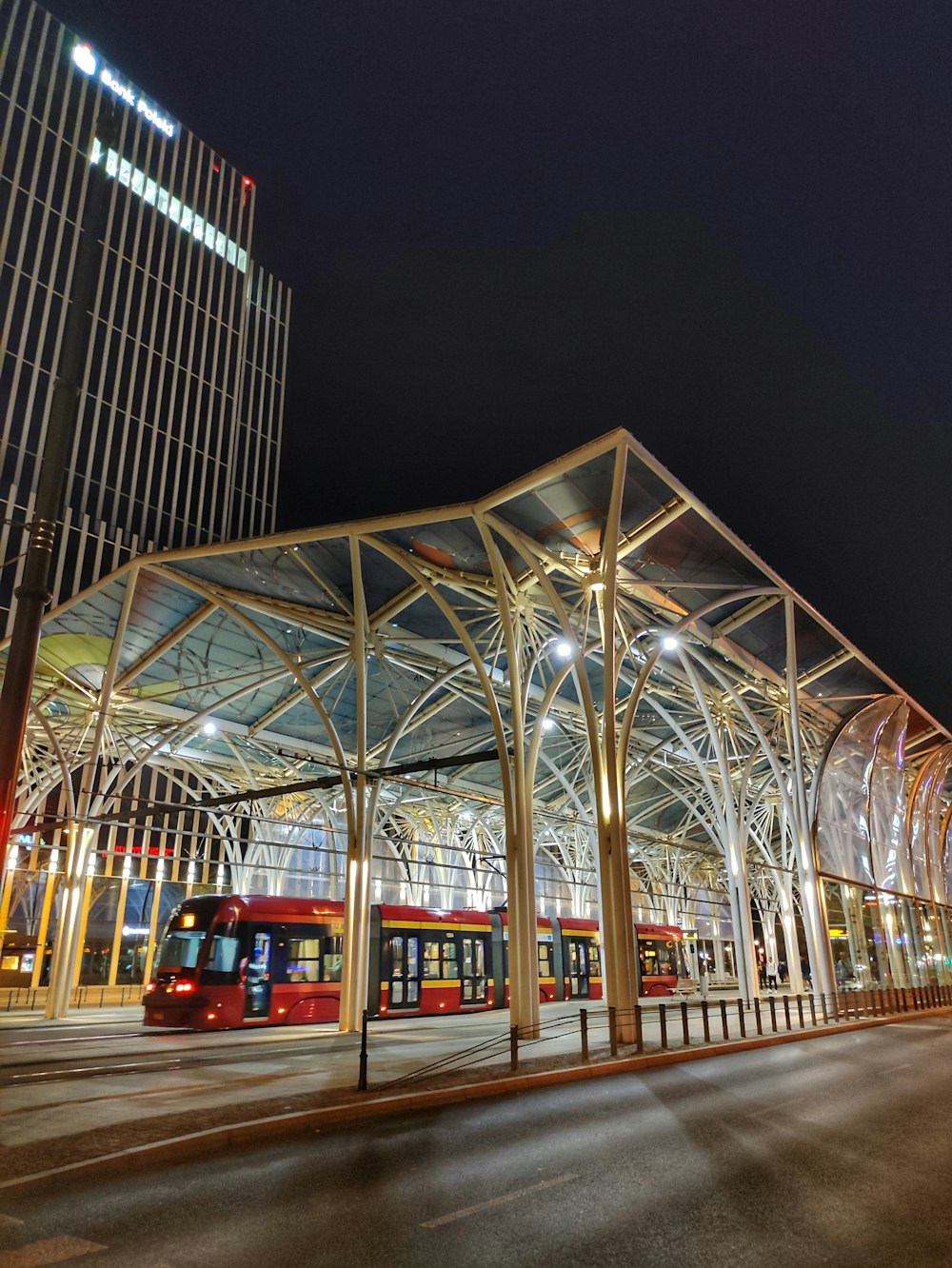 a train station with a train on the tracks