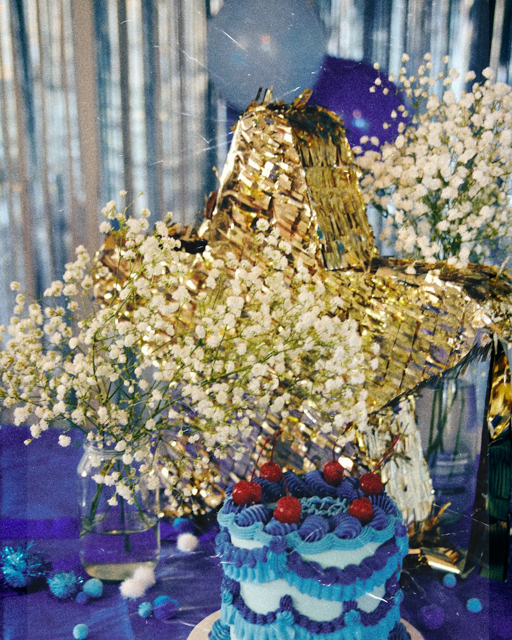 a blue and white cake sitting on top of a table