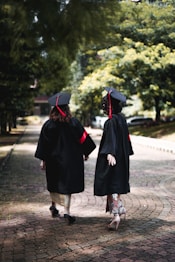 a couple of people that are walking down a street