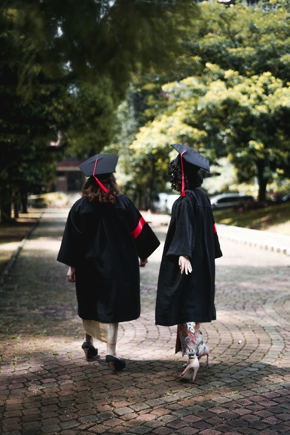 a couple of people that are walking down a street