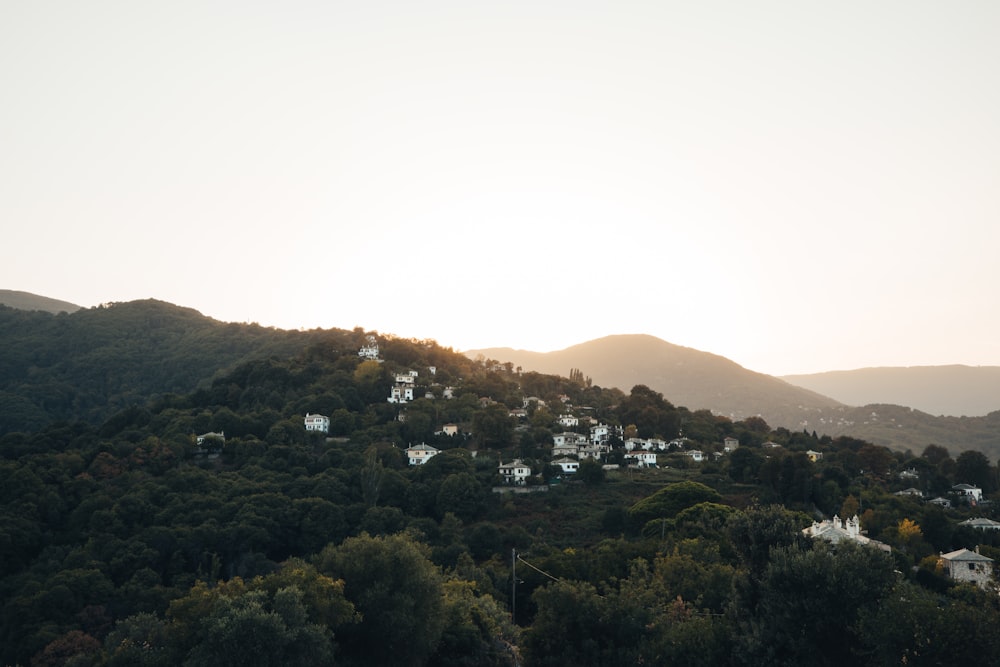 a view of a hillside with houses on it