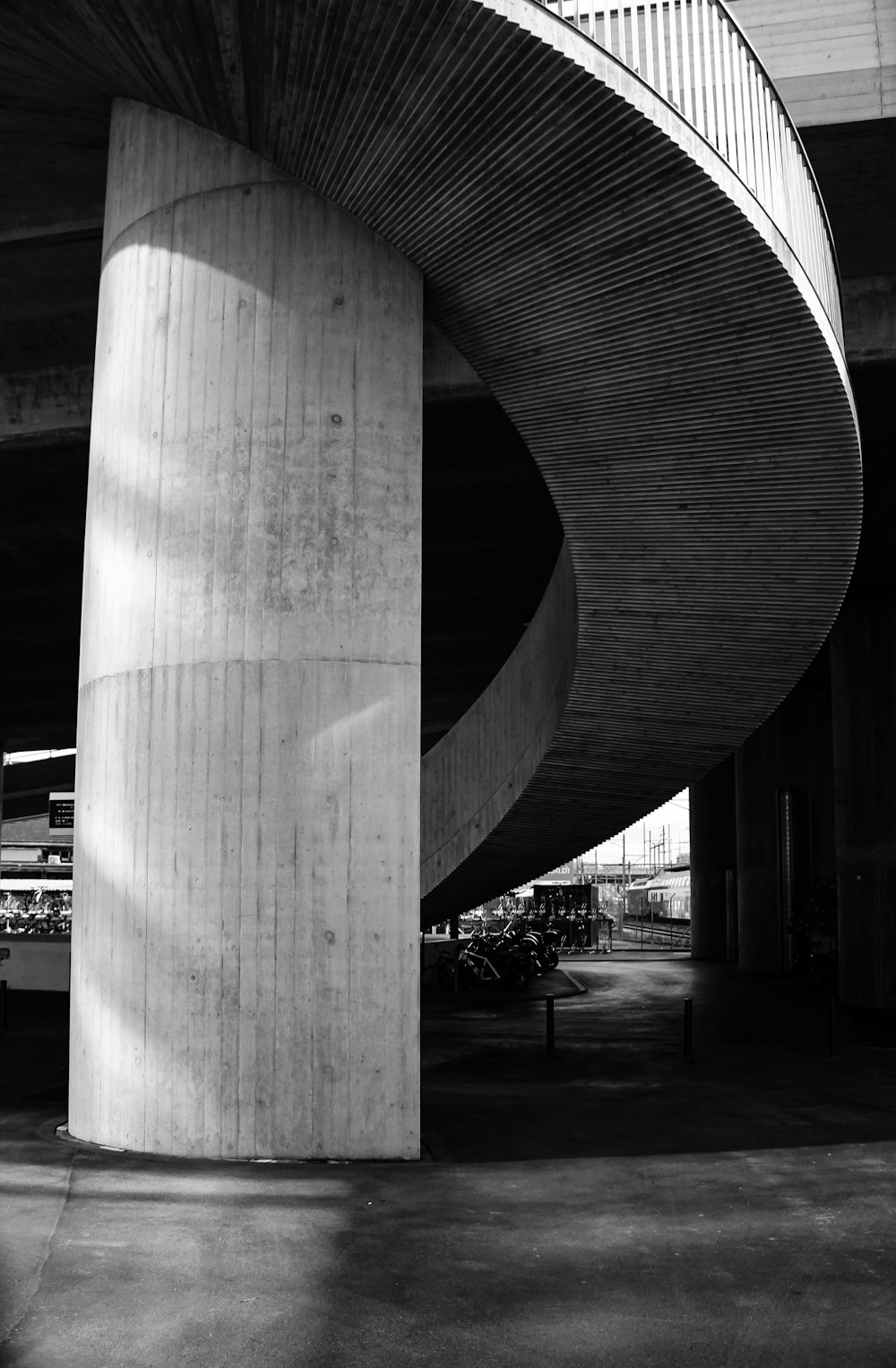 a black and white photo of a spiral staircase