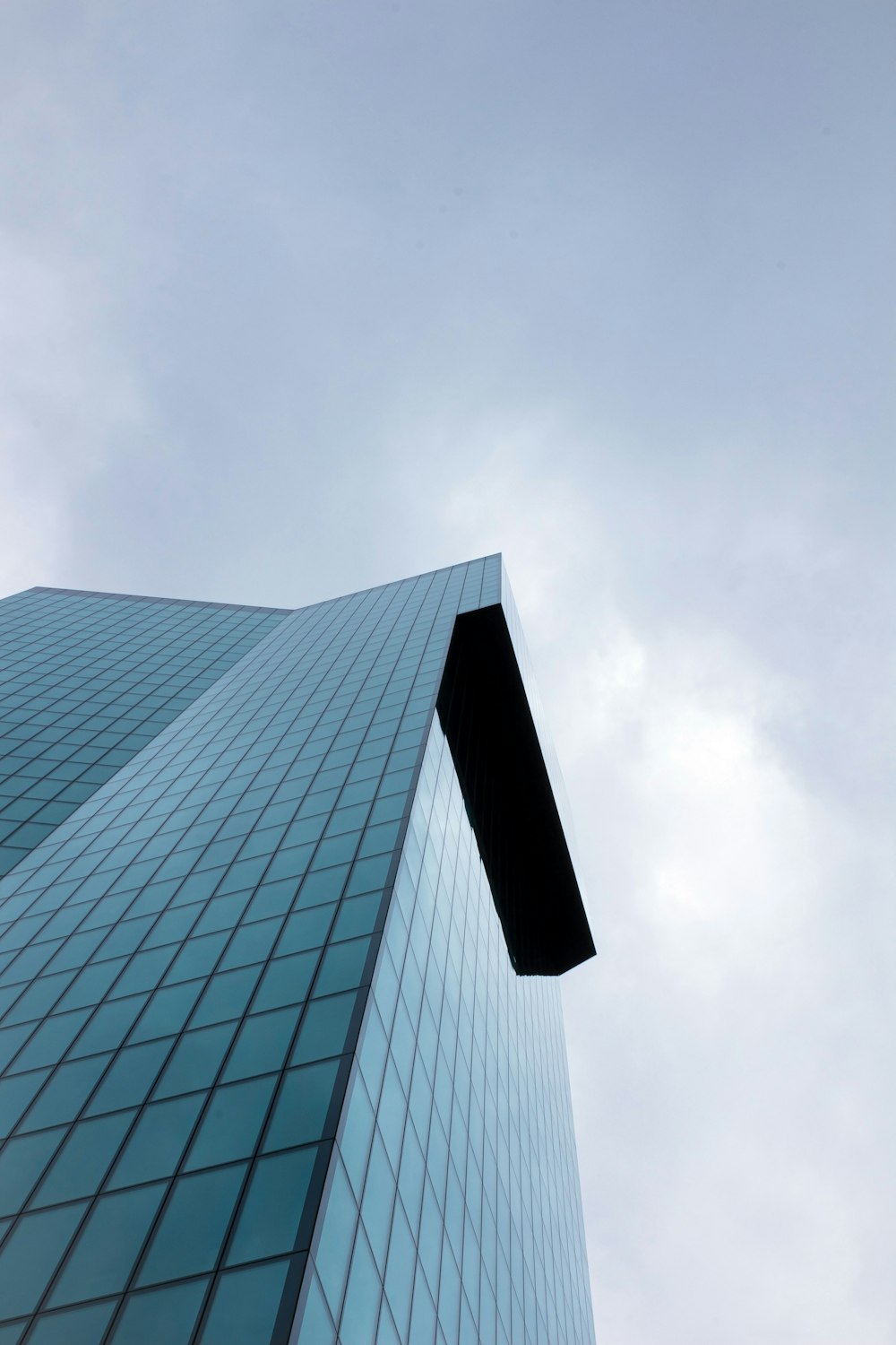 a very tall building with a sky in the background