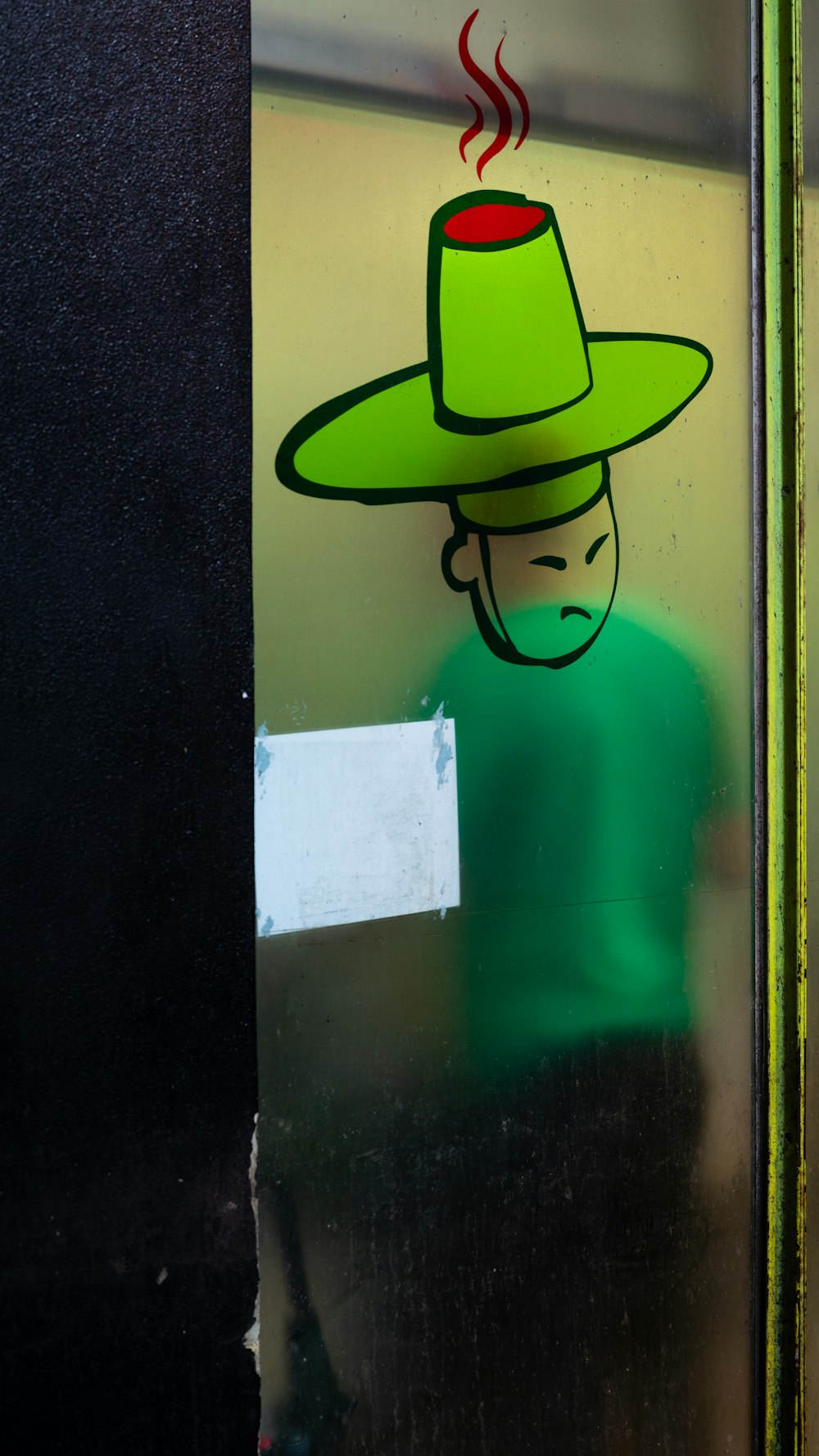 a picture of a man wearing a green hat