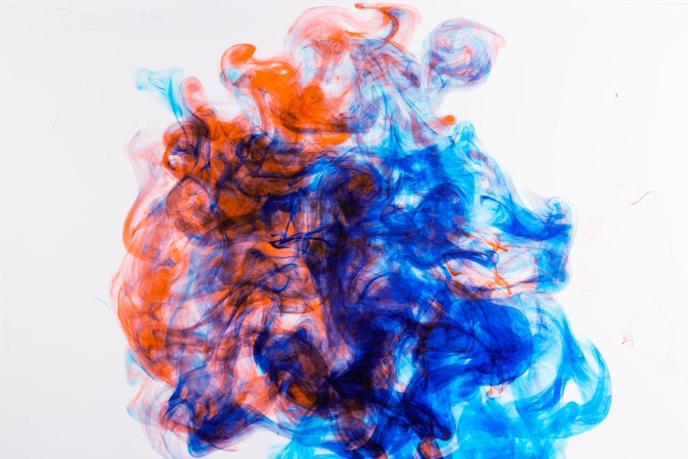 a mixture of blue and orange ink in water