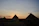 Smiling traveler enjoying a sunset view of the Pyramids of Giza.