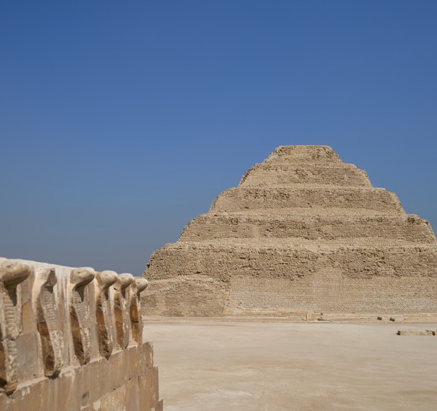 a very tall pyramid sitting in the middle of a desert