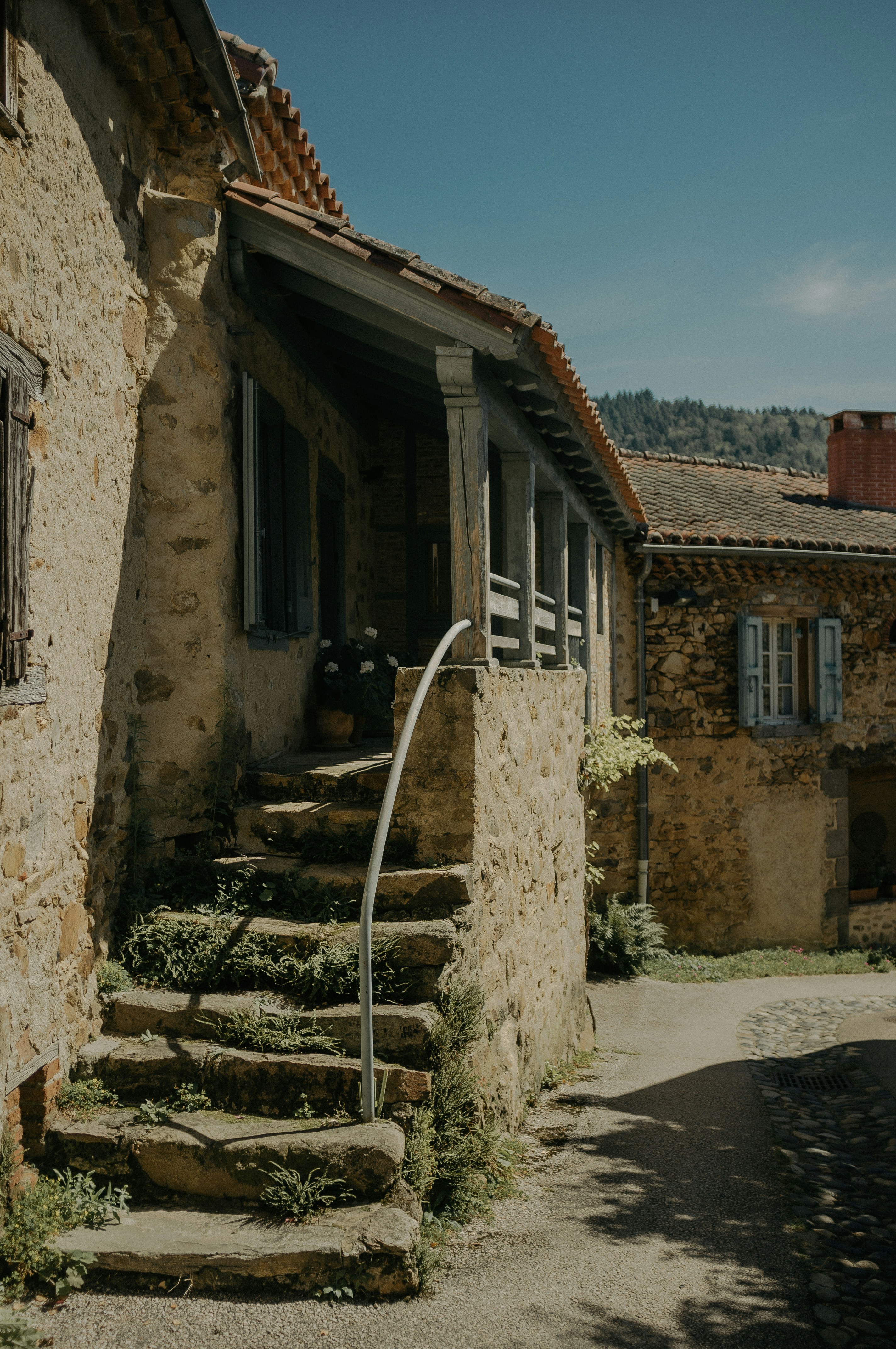 a set of stone steps leading up to a house