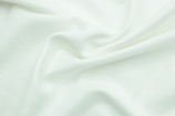 a close up view of a white fabric