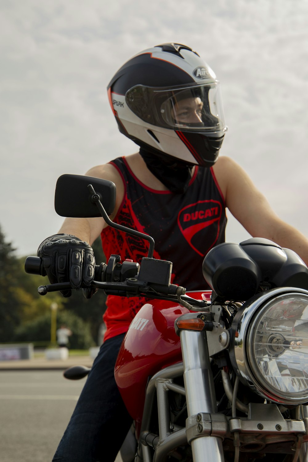 a person wearing a helmet is riding a motorcycle