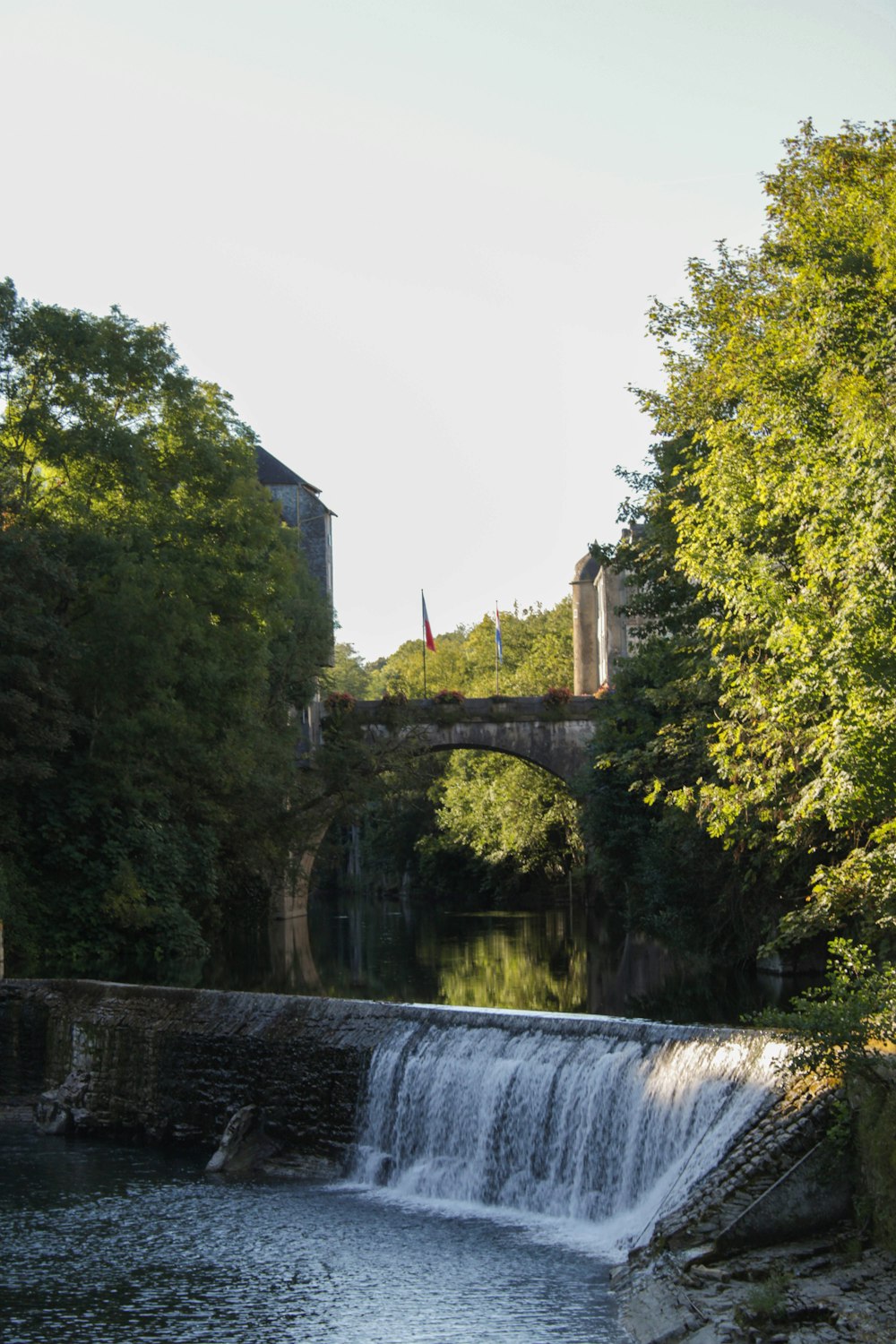 a small waterfall in the middle of a river