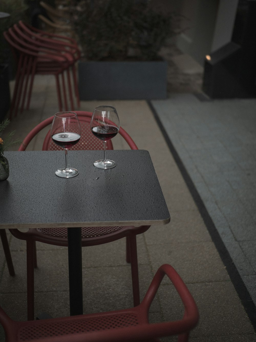 a table with two glasses of wine on it