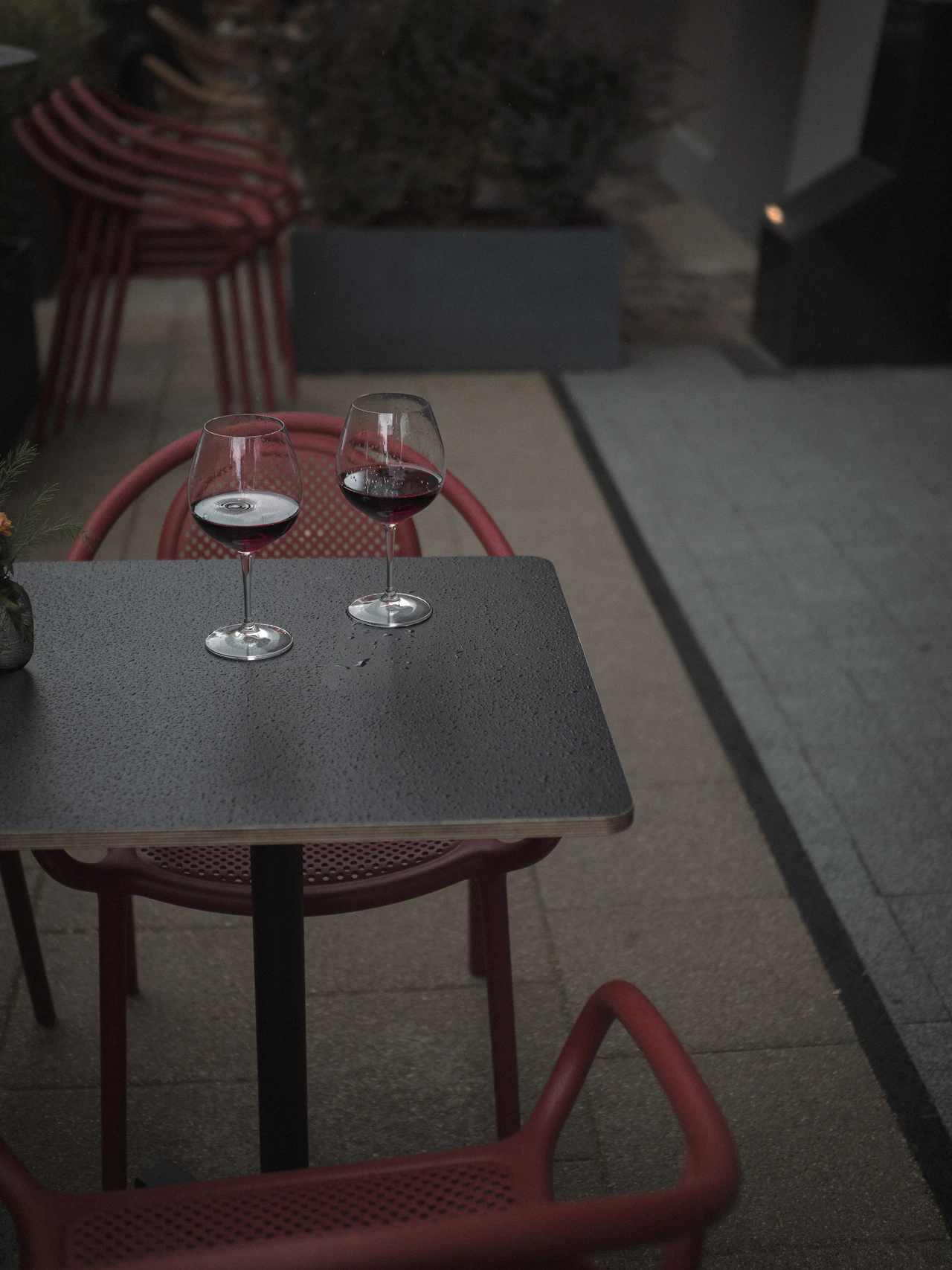 Two glasses of wine on a marble table