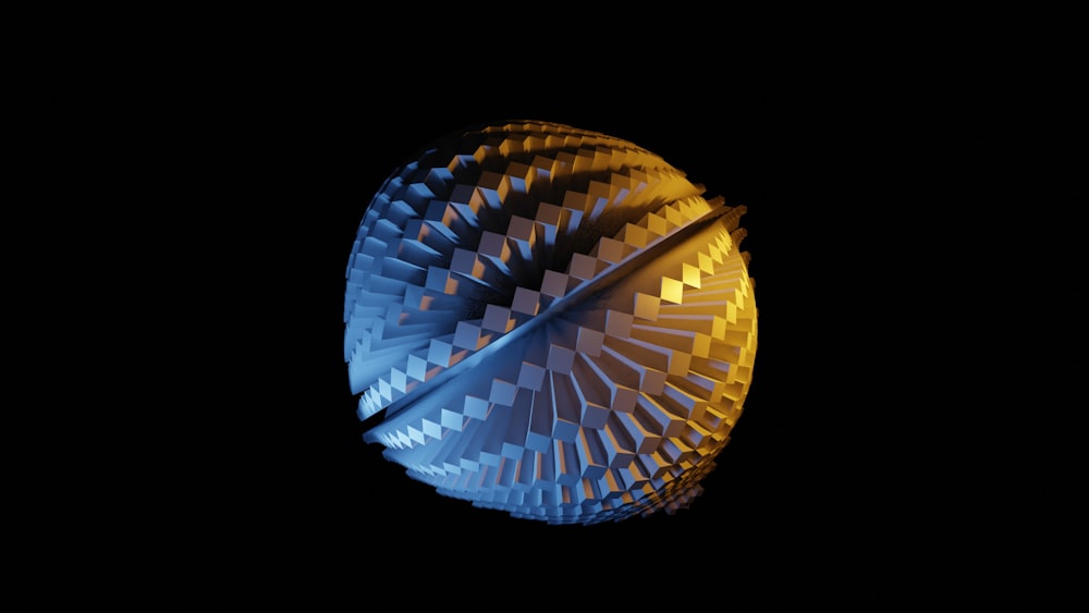 a close up of a blue and yellow object in the dark