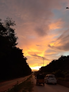 A taxi cruising along the highway between Delhi and Dehradun at sunset.